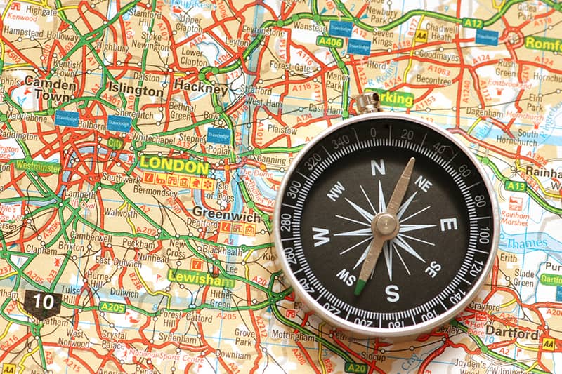 A road map of London with a compass.